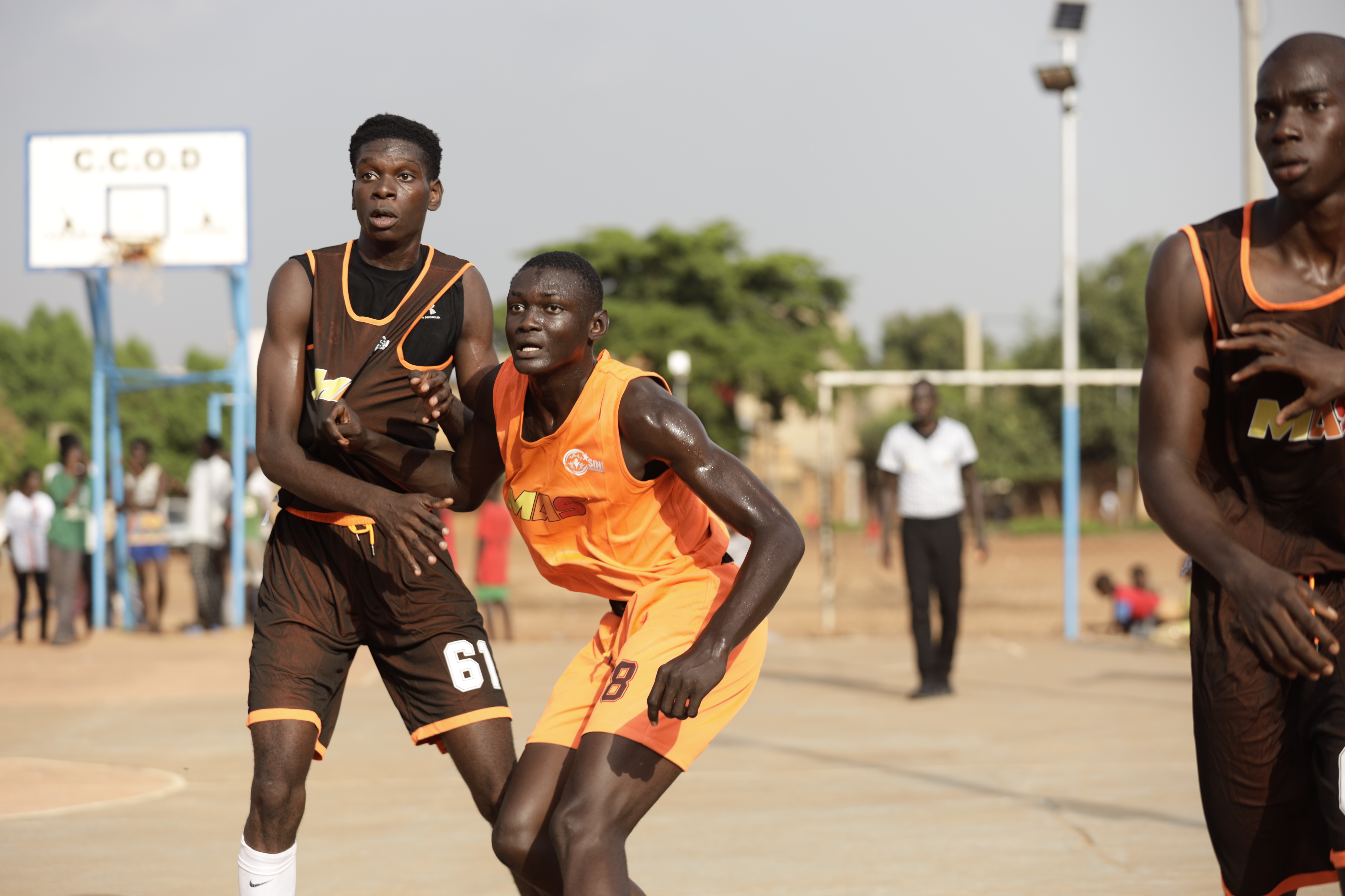 Young African basketball players competing in front of international scouts