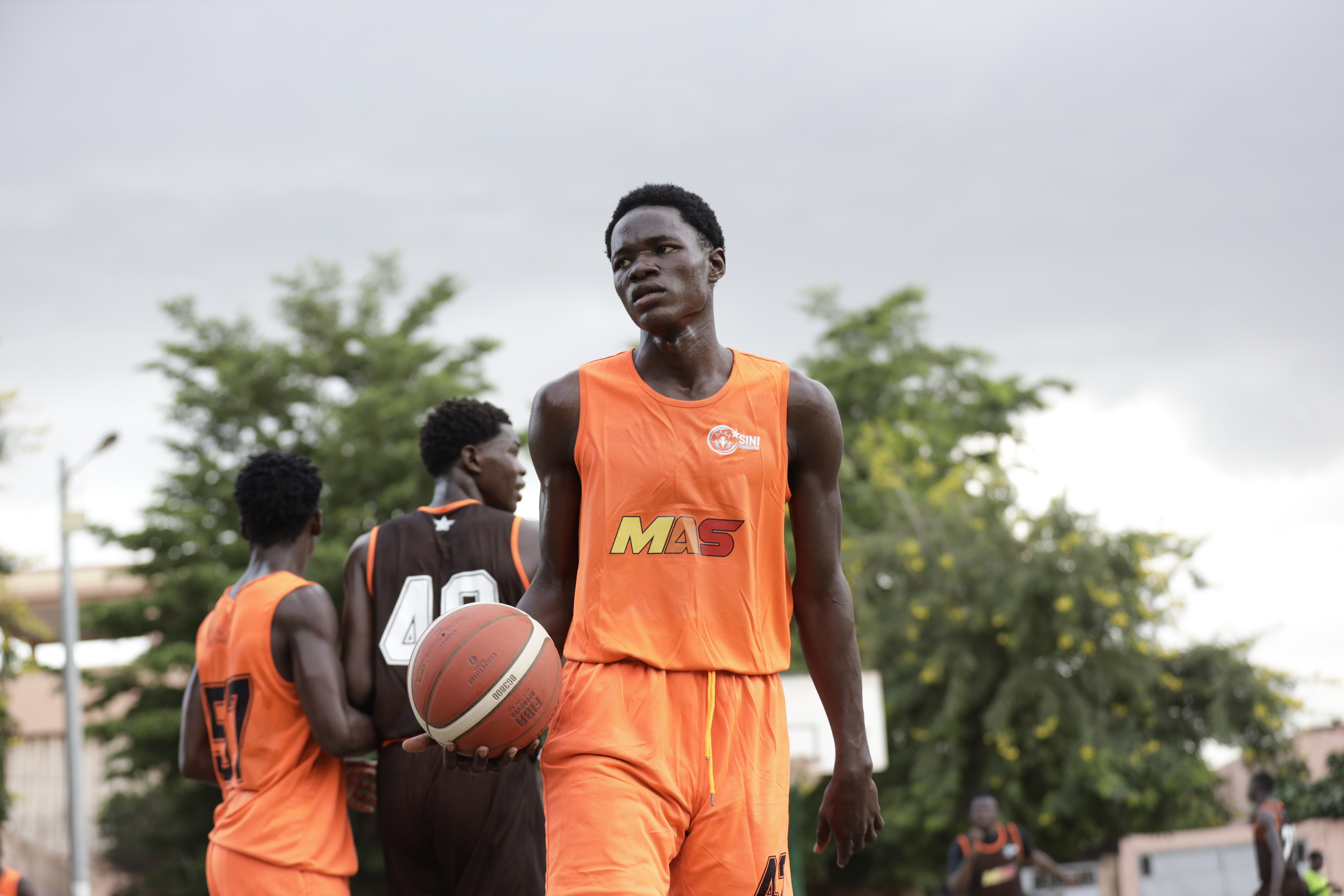 African basketball prospect demonstrating skills during scouting event